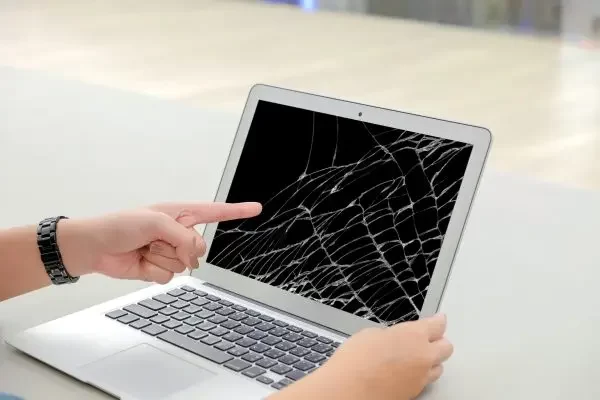 hands-pointing-cracked-laptop-screen-min-scaled-q1o3u75gmh6q1yjm003fregvkdi21qjuexnl3nchb4-min.webp